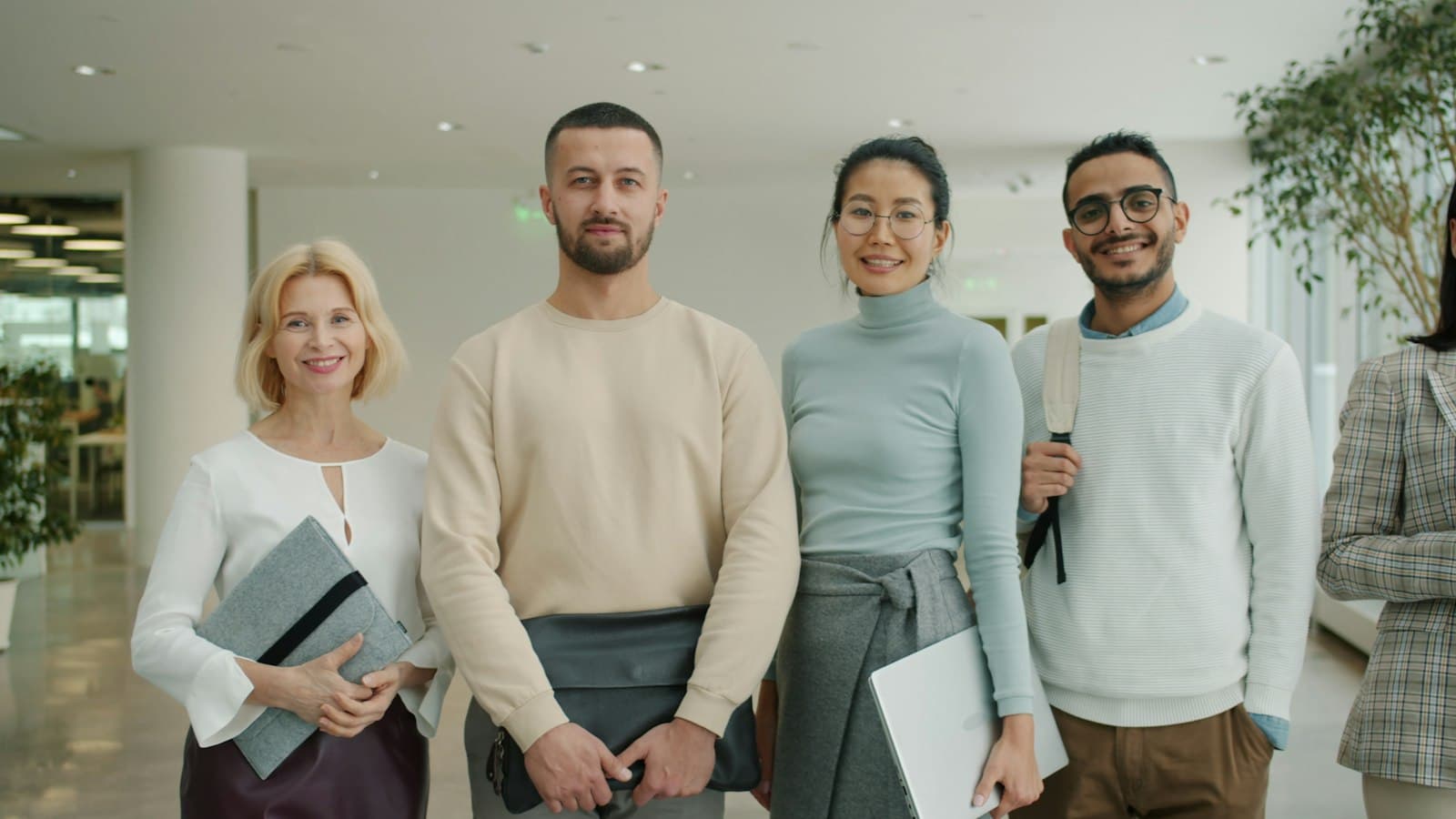 A diverse group of healthcare professionals smiling together