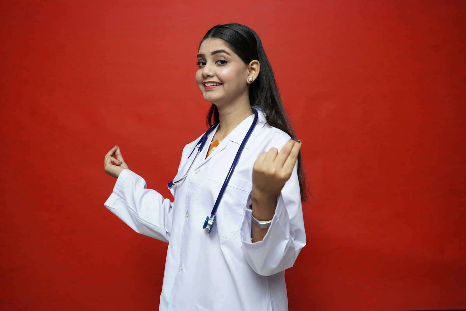 A smiling young healthcare professional with a stethoscope